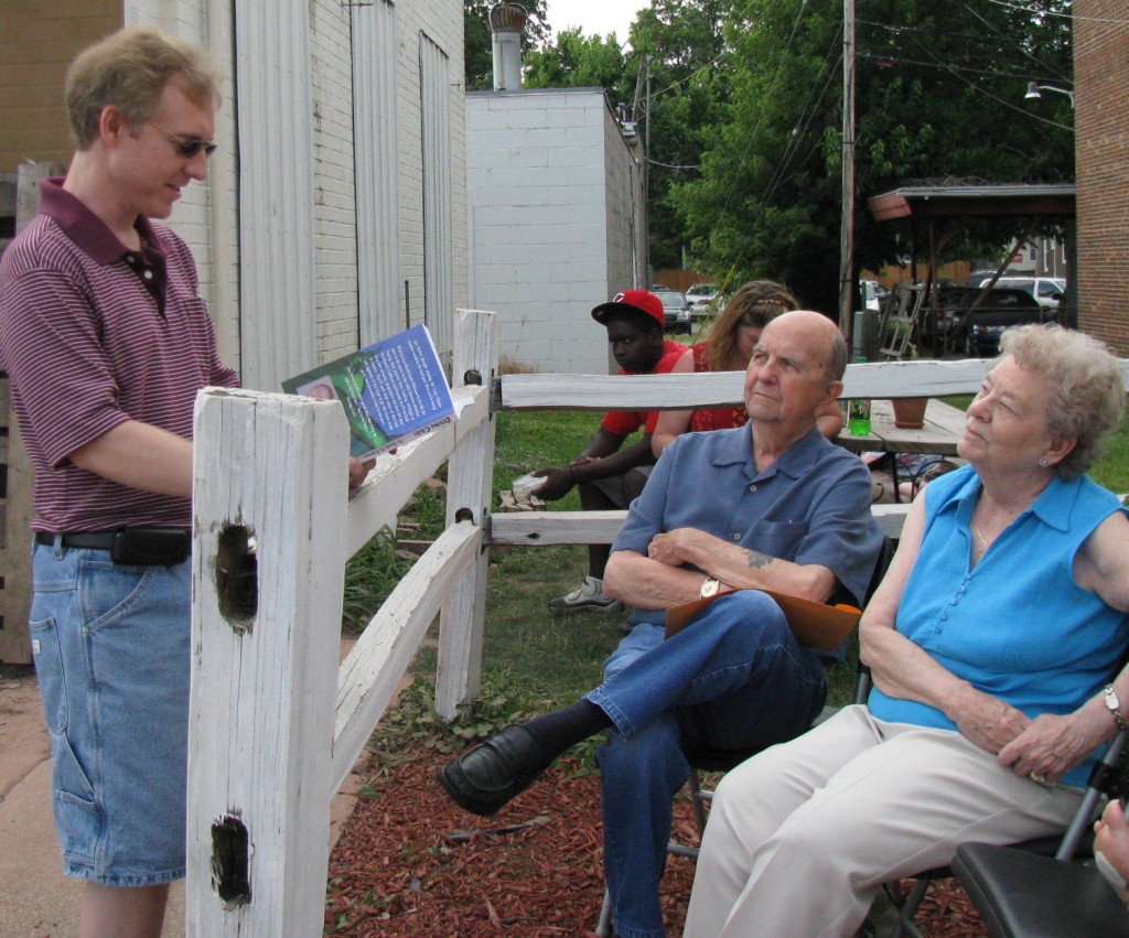 Reading to Jan McCaffrey and her husband, among others